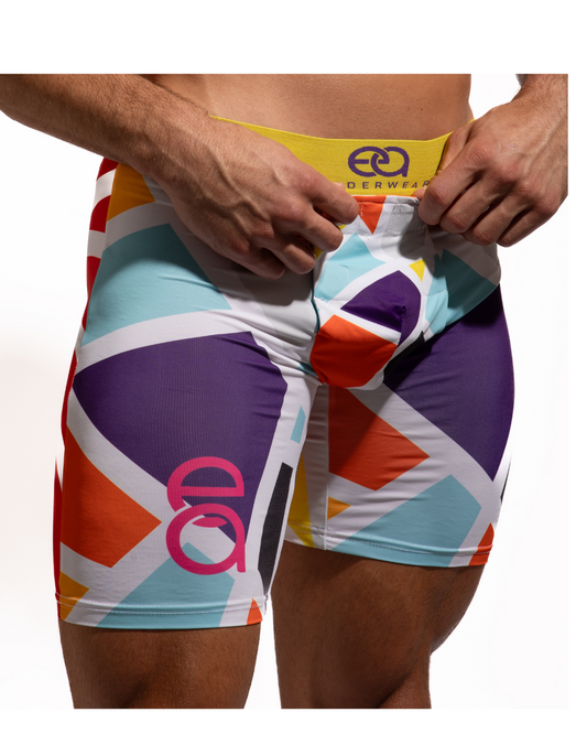 Colorful athletic shorts with geometric pattern and brand logo on a white background, Front View