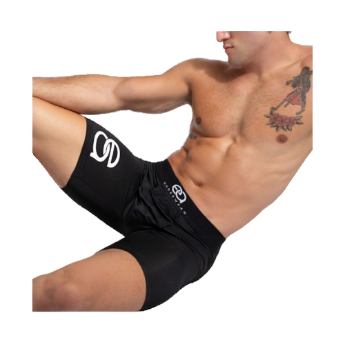 Man wearing black athletic shorts with a logo on a white background